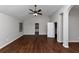 Large main bedroom with hardwood floors and en-suite bathroom access at 7502 Springbox Dr, Fairburn, GA 30213
