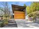 Contemporary home with wooden garage door and landscaped yard at 882 Durant Ne Pl, Atlanta, GA 30309