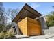 Modern home with wood siding, concrete accents, and a covered deck at 882 Durant Ne Pl, Atlanta, GA 30309