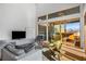 Bright living room with hardwood floors and sliding doors to deck at 882 Durant Ne Pl, Atlanta, GA 30309