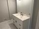 Updated bathroom with white vanity and marble countertop at 2289 Aurie Dr, Decatur, GA 30034