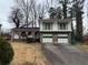 Brick house with two-story addition, attached garage, and landscaped yard at 2289 Aurie Dr, Decatur, GA 30034