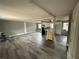 Open living room and kitchen with gray walls and vinyl flooring at 2289 Aurie Dr, Decatur, GA 30034