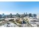 An aerial view showcasing the cityscape, including high-rises and shopping centers at 3630 Peachtree Ne Rd # 2104, Atlanta, GA 30326