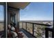 Private balcony with city views and wooden chairs at 3630 Peachtree Ne Rd # 2104, Atlanta, GA 30326