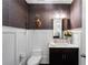 Elegant powder room with textured wallpaper and a classic pedestal sink at 3630 Peachtree Ne Rd # 2104, Atlanta, GA 30326