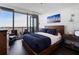 Bright bedroom with a large bed, city views, and hardwood floors at 3630 Peachtree Ne Rd # 2104, Atlanta, GA 30326