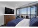 Main bedroom with city views and a large TV at 3630 Peachtree Ne Rd # 2104, Atlanta, GA 30326