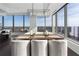 Modern dining area with city views and a wood table at 3630 Peachtree Ne Rd # 2104, Atlanta, GA 30326