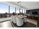 Modern dining area with city views, wood table, and white chairs at 3630 Peachtree Ne Rd # 2104, Atlanta, GA 30326