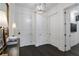 Well-lit foyer featuring dark wood floors, white walls, and contemporary lighting at 3630 Peachtree Ne Rd # 2104, Atlanta, GA 30326