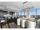 Modern kitchen with dark cabinetry and island seating at 3630 Peachtree Ne Rd # 2104, Atlanta, GA 30326