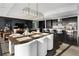 Modern kitchen with dark cabinets, quartz counters, and island seating at 3630 Peachtree Ne Rd # 2104, Atlanta, GA 30326
