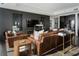 Luxurious living room with leather sofas and a modern media wall at 3630 Peachtree Ne Rd # 2104, Atlanta, GA 30326