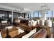 Open concept living area with leather sofas and modern finishes at 3630 Peachtree Ne Rd # 2104, Atlanta, GA 30326
