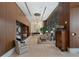 Elegant building lobby with seating area, large windows, and wood features at 3630 Peachtree Ne Rd # 2104, Atlanta, GA 30326