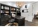 Bright home office with custom shelving, desk and rolling chair at 3630 Peachtree Ne Rd # 2104, Atlanta, GA 30326