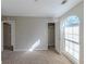 Bright bedroom with window and closet at 5370 Biffle Ln, Stone Mountain, GA 30088