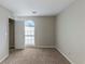 Well-lit bedroom with a large window and closet at 5370 Biffle Ln, Stone Mountain, GA 30088