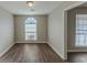 Dining room with hardwood floors and an arched window at 5370 Biffle Ln, Stone Mountain, GA 30088