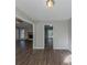 Bright dining area with hardwood floors and views of the living room and kitchen at 5370 Biffle Ln, Stone Mountain, GA 30088