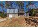 Two-story house with attached garage and yard at 5370 Biffle Ln, Stone Mountain, GA 30088