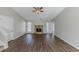 Living room with hardwood floors, fireplace, and lots of natural light at 5370 Biffle Ln, Stone Mountain, GA 30088