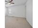 Carpeted bedroom with a ceiling fan and large window at 3900 Belle Glade Trl, Snellville, GA 30039