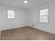 Bright bedroom with hardwood floors and neutral walls at 5496 Davis Dr, Austell, GA 30106