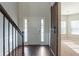 Bright entryway with a white door and dark hardwood floors at 950 Spanish Moss Trl, Loganville, GA 30052