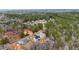 Aerial view of a new community in a wooded area, showcasing multiple homes under construction at 4271 Matisse Ln, Fairburn, GA 30213