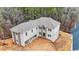 Aerial view of a large two-story home with a spacious, unfinished yard and an attached garage at 4271 Matisse Ln, Fairburn, GA 30213