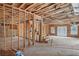 Unfinished basement with framing, stairs, concrete foundation, and potential for customization at 4271 Matisse Ln, Fairburn, GA 30213