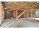 Unfinished basement view showcasing the framing and stairs leading to the upper level at 4271 Matisse Ln, Fairburn, GA 30213