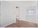 Bedroom with hardwood flooring, a double door closet, and natural light from the window at 4271 Matisse Ln, Fairburn, GA 30213
