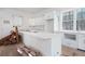 Spacious unfinished kitchen with a large island, custom cabinets and a large window above the countertop at 4271 Matisse Ln, Fairburn, GA 30213