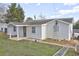 Another view of the renovated home, highlighting the new roof and siding at 840 Forrest St, Roswell, GA 30075
