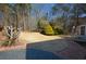Landscaped backyard with brick patio at 125 Lamberth Lake Dr, Fayetteville, GA 30215