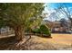 Large backyard with lush trees and hammock at 125 Lamberth Lake Dr, Fayetteville, GA 30215