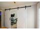 White double barn doors with an X design, opening to an office at 125 Lamberth Lake Dr, Fayetteville, GA 30215