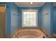 Bathroom with a large jetted tub and a window at 125 Lamberth Lake Dr, Fayetteville, GA 30215