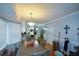 Bright dining room with a table and view into kitchen at 125 Lamberth Lake Dr, Fayetteville, GA 30215