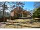 Brick house with a screened porch and yard at 125 Lamberth Lake Dr, Fayetteville, GA 30215