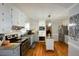 Kitchen boasts granite counters, stainless steel appliances, and an island at 125 Lamberth Lake Dr, Fayetteville, GA 30215