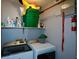 Bright laundry room with washer, dryer, and shelving at 125 Lamberth Lake Dr, Fayetteville, GA 30215