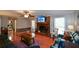 Spacious living room featuring hardwood floors, fireplace, and ample natural light at 125 Lamberth Lake Dr, Fayetteville, GA 30215