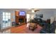 Living room with hardwood floors, fireplace, and comfy seating at 125 Lamberth Lake Dr, Fayetteville, GA 30215