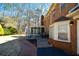 Brick patio and walkway lead to a screened porch at 125 Lamberth Lake Dr, Fayetteville, GA 30215