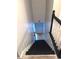 Black staircase leading to lower level with white railing at 125 Lamberth Lake Dr, Fayetteville, GA 30215