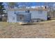 Large backyard with trampoline and partial view of home's exterior at 830 Forrest St, Roswell, GA 30075
